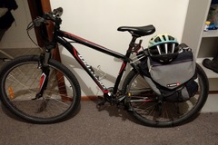 Daily Rate: second hand mountain bike with saddle bags, bike chain and helmet