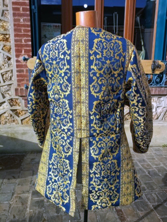 Jerkin with punctured sleeves, blue and gold