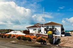 Accommodation Per Night: Surfer's seafront apartment- British Isles