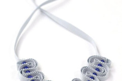  : Pale grey ribbon necklace with blue beads
