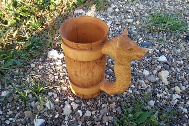 Wooden mug with wolf as handle