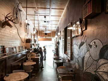 Walk-in: Cosy backroom filled with sofas & tables perfect for laptop users