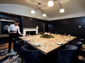 Book a meeting : The Lounge | featuring an open fire place, dark moody wood & TV