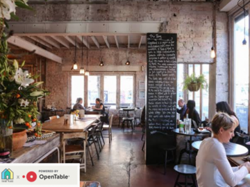Free | Book a table: Vibrant communal table, cozy window seats, & a plethora of plants