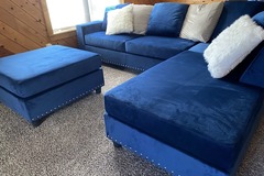 Selling with online payment:  Modern style blue velvet reversible sectional with nailhead trim