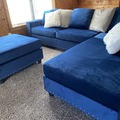 Selling with online payment:  Modern style blue velvet reversible sectional with nailhead trim