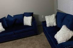 Selling with online payment: Modern velvet blue sofa and love seat with nailhead accents - new