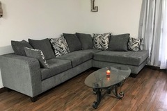 Selling with online payment: Dark grey sectional includes throw pillows - new