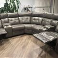 Selling with online payment: Grey leather reclining sectional with cupholders - New