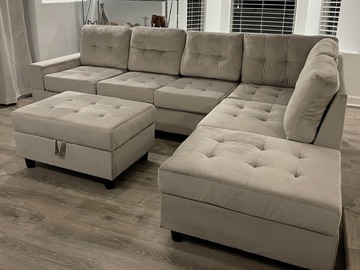 Selling with online payment: Silver tufted velvet reversible sectional and storage ottoman