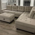 Selling with online payment: Silver tufted velvet reversible sectional and storage ottoman