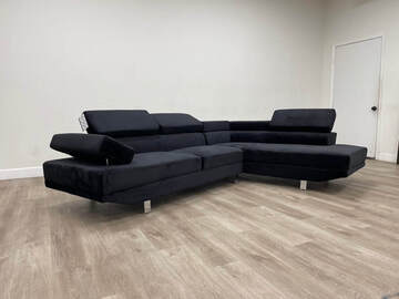 Selling with online payment: Contemporary tufted black sectional with chrome legs - new