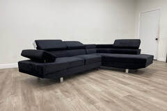 Selling with online payment: Contemporary tufted black sectional with chrome legs - new