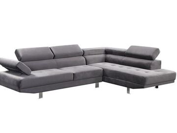 Selling with online payment: Contemporary tufted grey sectional with chrome legs - new