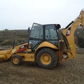 En alquiler: PALA Y RETRO  CAT / JOHN DEERE