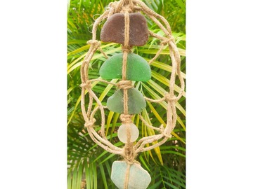  : oval shaped wall decoration with liana from jungle and sea glass