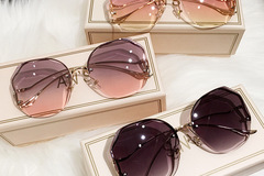 Comprar ahora: 30 pcs Fashion Rimless Sunglasses Sunscreen Glasses