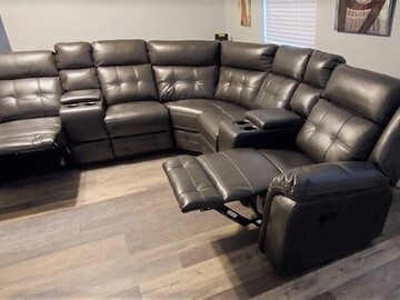 Selling with online payment: Grey leather reclining sectional with cup holders - NEW