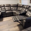 Selling with online payment: Grey leather reclining sectional with cup holders - NEW