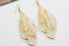 Buy Now: 100 pairs of fashionable hollow metal leaf tassel earrings