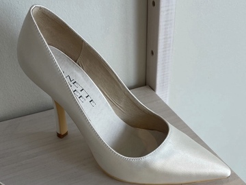Selling: White heels