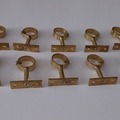 À vendre: Lot de 12 supports dorés pour tringles à rideaux