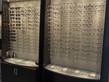 Selling with online payment: Custom EyeDesigns Frame Boards with dispensing tables.  