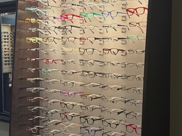 Selling with online payment: Custom EyeDesigns Frame Boards with dispensing tables.  