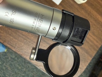 Selling with online payment: Heine slit lamp- hand-held with handle, uses AA batteries